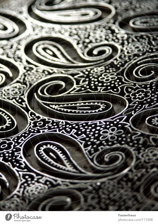 Schnörkel Muster Eisen antik Kunst Kunsthandwerk Makroaufnahme Nahaufnahme Handwerk Stempel stoffstempel alt