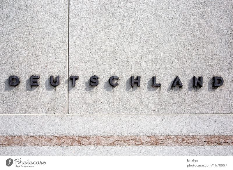 Deutschland. erhabene Schrift auf einer Steinmauer Schriftzeichen Mauer Wand Metall Linie einfach positiv grau schwarz selbstbewußt Gesellschaft (Soziologie)