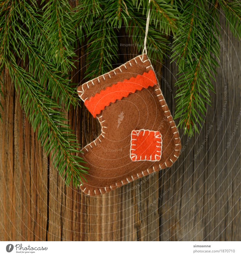 Weihnachten Holzhintergrund mit einem Filz Stiefel Handarbeit stricken Baum Stoff Fahne lang Hintergrundbild Wolle Maserung Textfreiraum gemütlich shabby