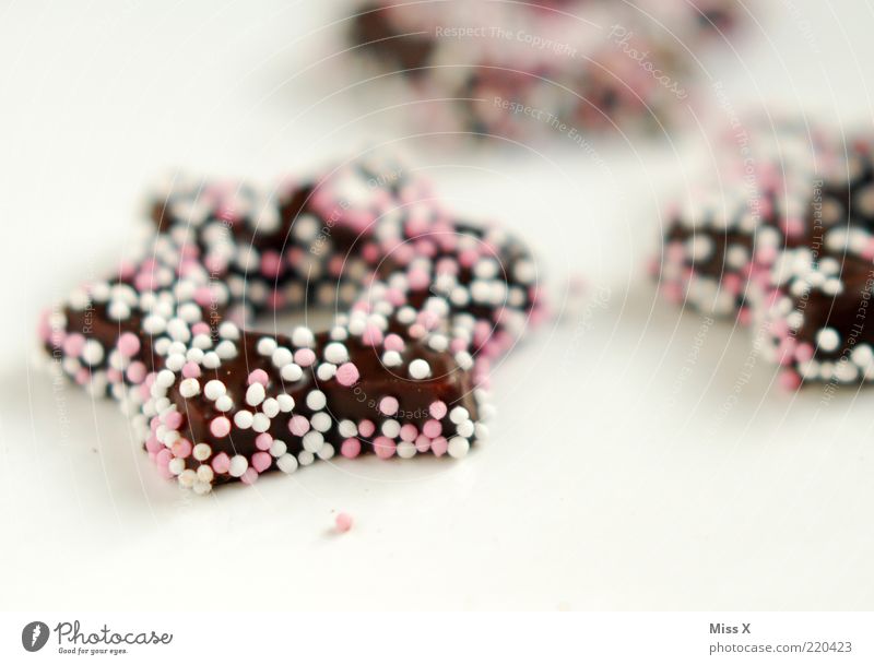 Zuckerstern Lebensmittel Teigwaren Backwaren Süßwaren Schokolade Ernährung lecker süß Zuckerperlen Zuckerstreusel Weihnachtsgebäck Stern (Symbol) Kuvertüre rosa