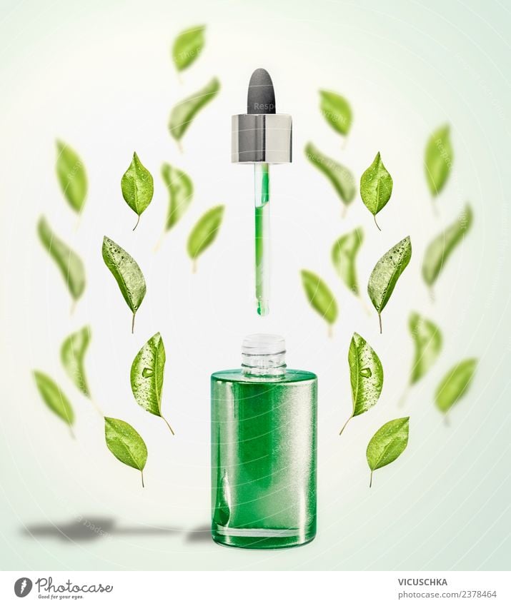 Grünes Gesichtsserum mit Pipette und grünen Blättern kaufen Stil Design schön Kosmetik Gesundheit Wellness Spa Natur Blatt Serum Hintergrundbild Flasche