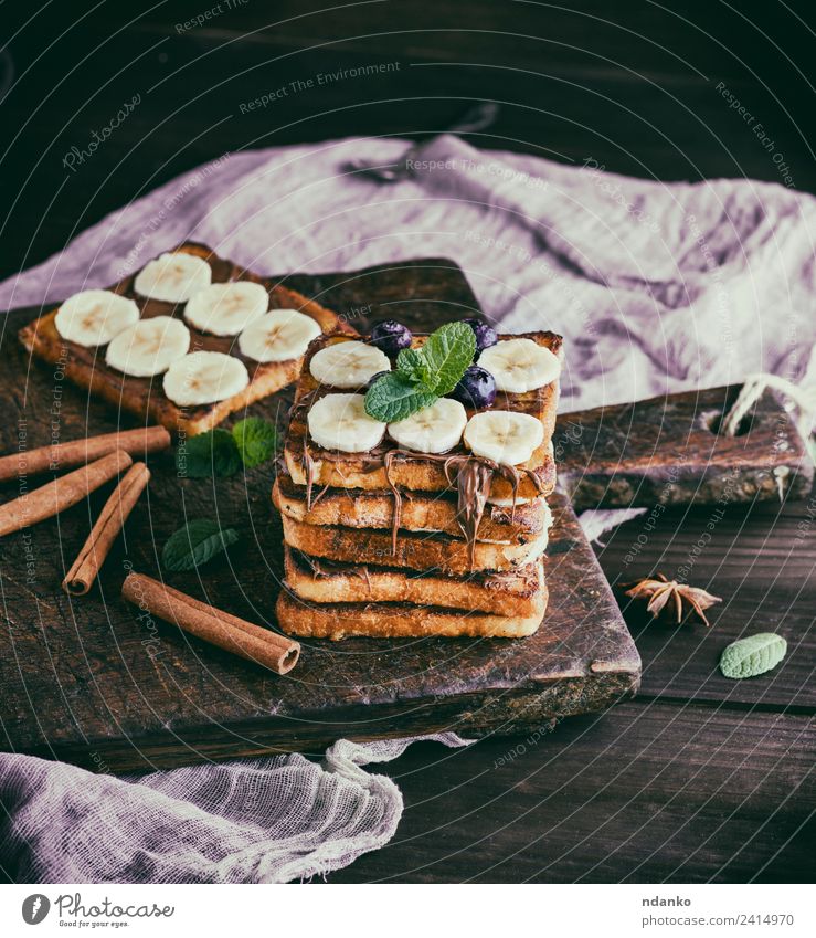 Brotscheiben mit Schokolade und Banane Frucht Dessert Süßwaren Ernährung Frühstück Blume Holz frisch lecker oben Tradition Zuprosten Französisch Hintergrund