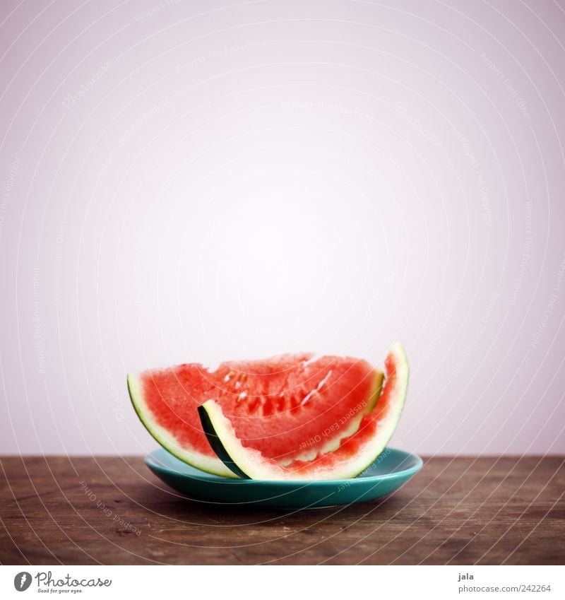 melone Lebensmittel Frucht Ernährung Bioprodukte Vegetarische Ernährung Diät Teller lecker Melonen Gesunde Ernährung Vitamin vitaminreich Holztisch Farbfoto