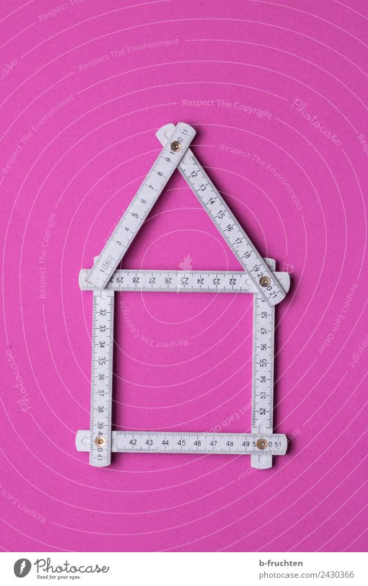 Zollstock - Hausbau - Planung Messinstrument rosa weiß Genauigkeit Häusliches Leben Zukunft Zusammenhalt Strukturen & Formen bauen Handwerker Baustelle Farbfoto