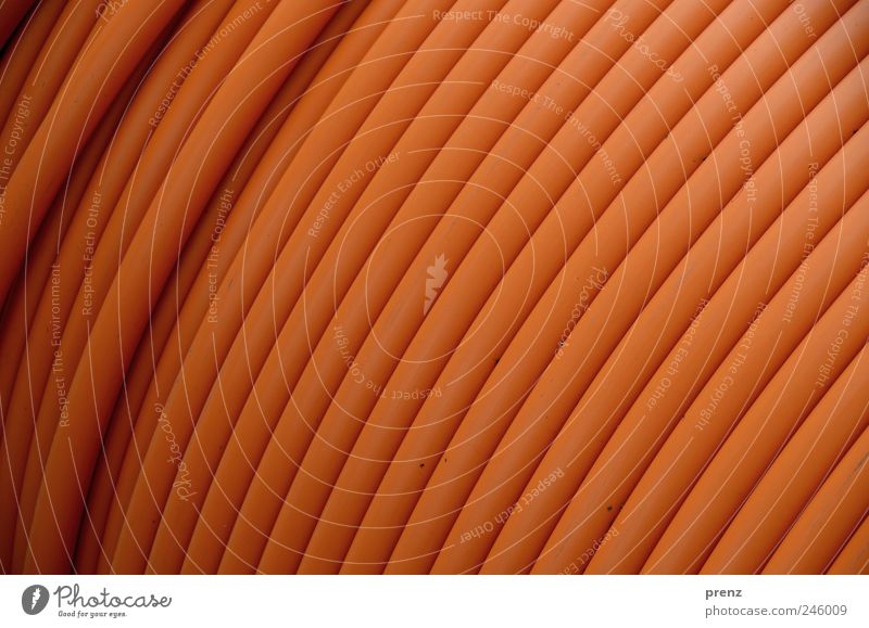 plastikdesign Kunststoff braun Röhren Leitung Kabel Linie aufgewickelt Farbfoto Außenaufnahme Nahaufnahme Licht Schwache Tiefenschärfe Zentralperspektive