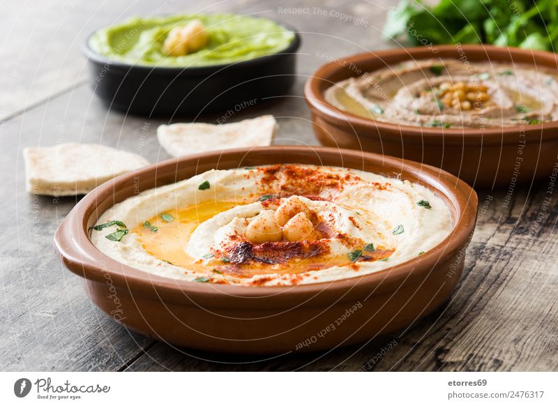Verschiedene Hummuschalen Lebensmittel Gemüse Getreide Ernährung Mittagessen Vegetarische Ernährung Asiatische Küche Schalen & Schüsseln Gesundheit gut braun