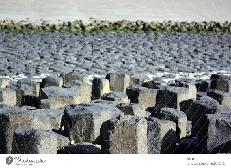 über stein und stein Umwelt Natur Landschaft Urelemente Sand Felsen Küste Strand Nordsee einfach Unendlichkeit küstenschutz Uferbefestigung Gezeiten Ebbe Stein