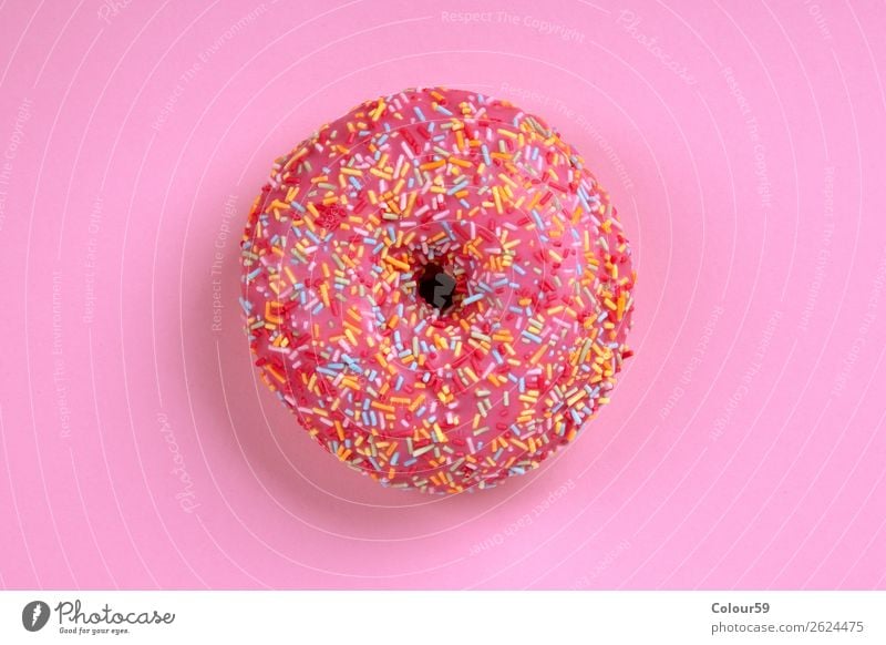 Suesser Donut Lebensmittel Dessert Süßwaren rosa Krapfen Hintergrundbild Top Snack dough Süßigkeit süß Essen Zucker Kalorien pink glasiert Zuckerstreusel bunt