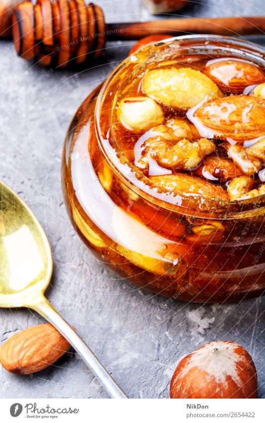 Honig mit Nüssen Nut Lebensmittel Liebling Gesundheit süß Mandel Ernährung Walnussholz organisch braun natürlich lecker Samen Produkt Frucht Dessert gelb