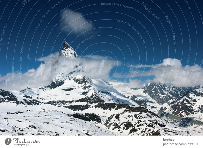 Matterhorn in Wolken II Berge u. Gebirge Urelemente Himmel Eis Frost Schnee Felsen Alpen Gipfel Schneebedeckte Gipfel Gletscher gigantisch groß kalt blau weiß