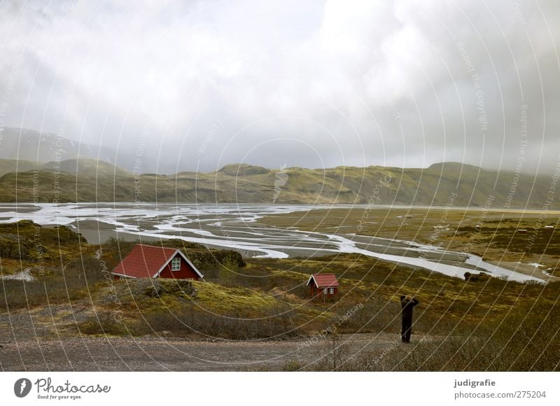 Island Umwelt Natur Landschaft Wasser Himmel Wolken Klima Hügel Felsen Berge u. Gebirge Haus Hütte Gebäude außergewöhnlich fantastisch natürlich wild Stimmung