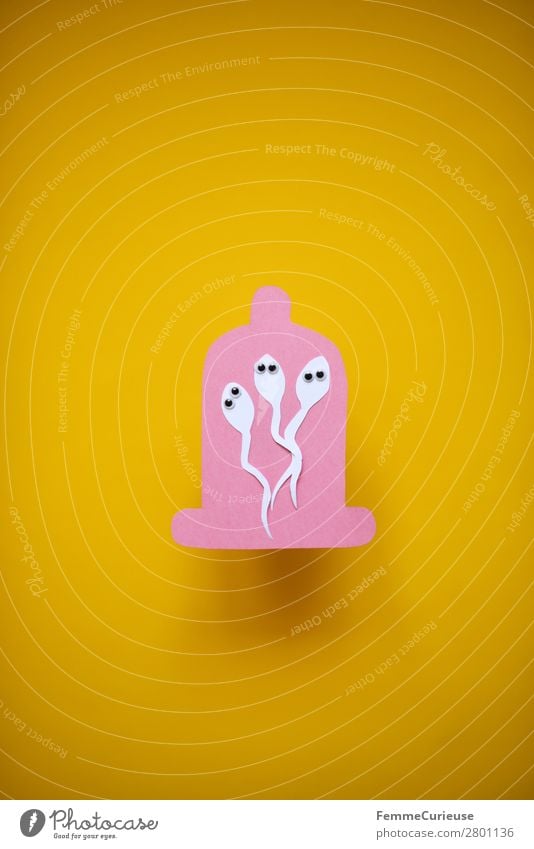 Contraception - sperm with wobbly eyes in condom Zeichen Sex Sexualität rosa gelb Papier ausgeschnitten Symbole & Metaphern Kondom Spermien 3 Wackelaugen Auge