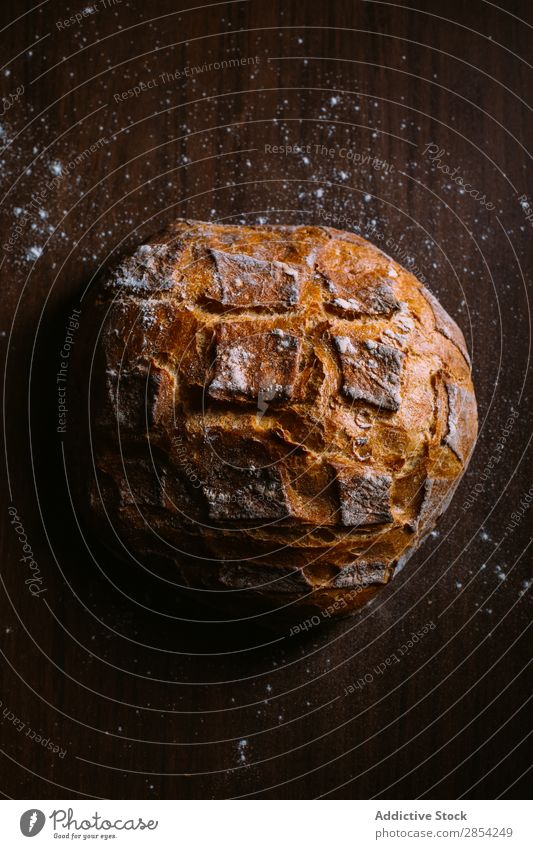 Hausgemachtes Brot backen dunkel Mehl Lebensmittel Vogelperspektive selbstgemacht selbstgebacken gebastelt Stimmung rustikal Holz