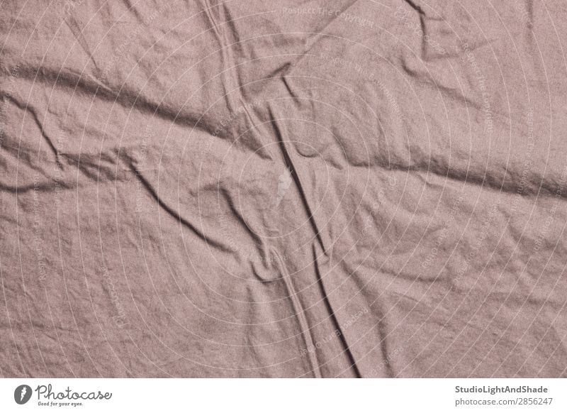 Textur von zerknitterter Bettwäsche Erholung Schlafzimmer Stoff modern Sauberkeit weich braun rosa Farbe Qualität Leinen Baumwolle Konsistenz Hintergrund