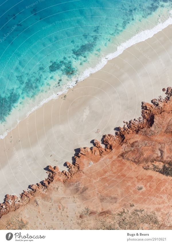 Küste Natur Landschaft Urelemente Erde Sand Wellen Strand Bucht Riff Meer Insel Abenteuer Australien Klippe türkis rot Reisefotografie ästhetisch beruhigend