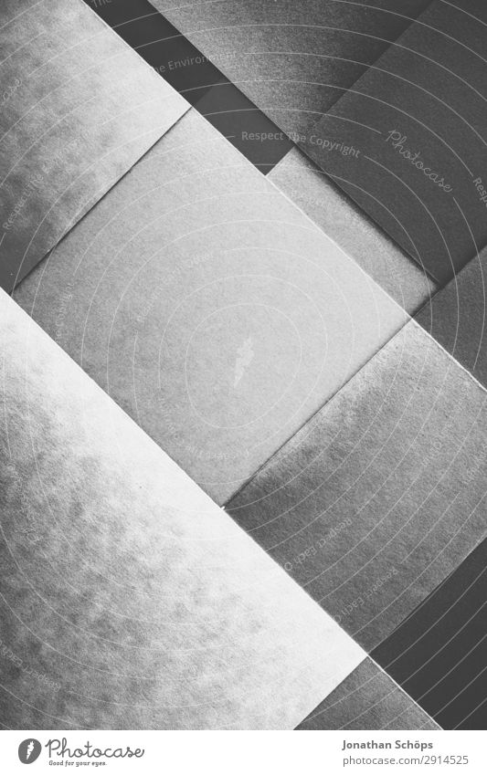 grafisches Hintergrundbild Schwarzweiß Basteln Papier leuchten einfach grau schwarz Buntpapier Quadrat flach Geometrie graphisch grell Entwurf minimalistisch
