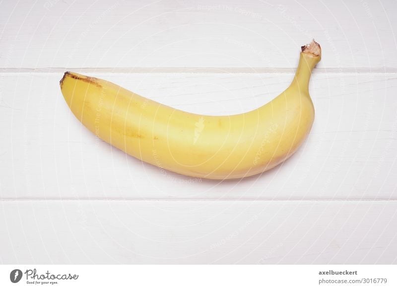 Banane Lebensmittel Frucht Ernährung Vegetarische Ernährung Gesunde Ernährung gelb Snack Vitamin Vegane Ernährung Vogelperspektive reif Südfrüchte Holztisch