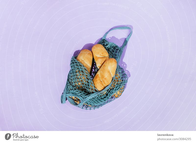 Brotlaibe in einer Netz-Produktionsbeutel Tasche braun Kordelzug ökologisch Umwelt Lebensmittel Gesundheit Gesunde Ernährung Zutaten Mahlzeit Gitter natürlich