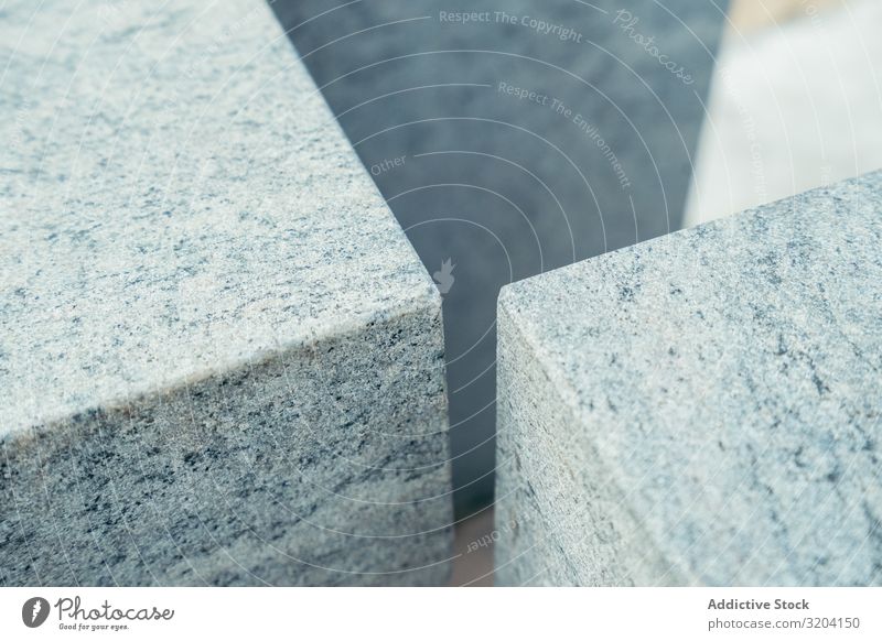 Winkel aus grauen Marmorwürfeln Würfel sanft Oberfläche Strand zarautz Spanien Stein Block Material solide Mineral Detailaufnahme Element Außenseite