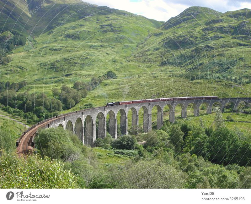 View to the popular bridge to Hogwarts in Scotland, knows from the Harry Potter films. summer medieval stone material construction industry history travel