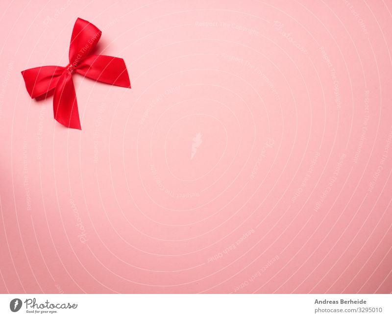 Rote Schleife auf rosa Hintergrund Stil Valentinstag Geburtstag Dekoration & Verzierung Liebe bow surprise ribbon birthday above abstract anniversary
