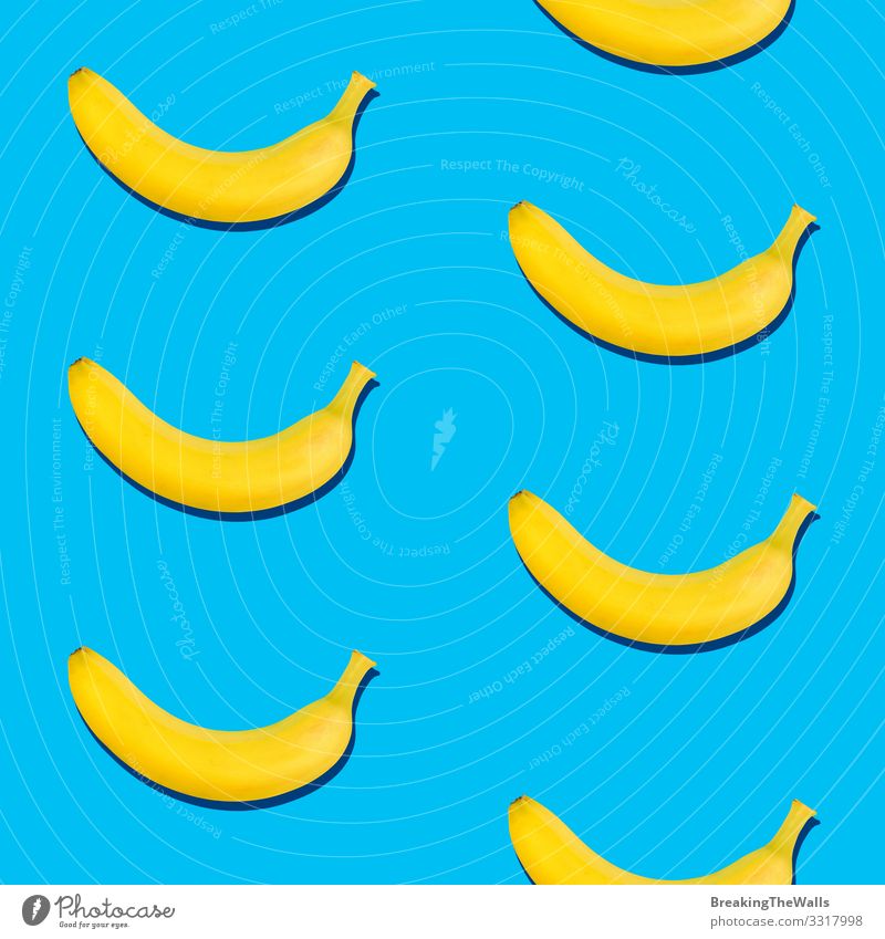 Nahtloses Muster aus Bananen auf blauem Hintergrund Frucht Vegetarische Ernährung Diät Design Gesunde Ernährung frisch gelb ästhetisch exotisch Farbe