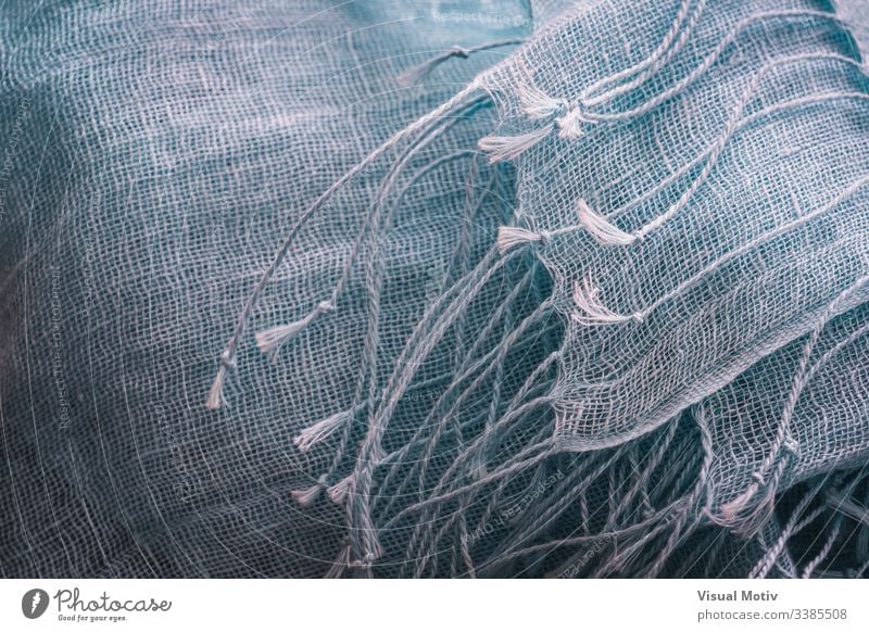 Zierfransen eines blauen Baumwollschals Gewebe Textur Schal Industrie texturiert Mode Hintergrund Oberfläche Design abstrakt Nahaufnahme niemand Detailaufnahme