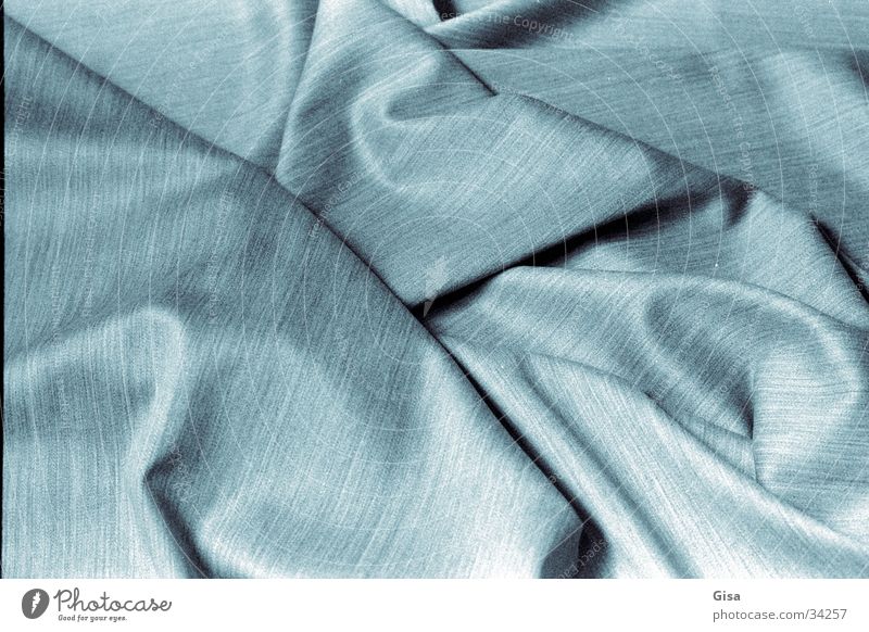 Falten 2 Faltenwurf Stoff Schurwolle Textilien weich Material Industrie Trapierung Stahlgrau blau