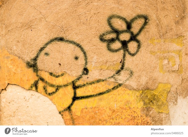 Flower Power Graffiti blumenkind Mauer Menschenleer Außenaufnahme Schriftzeichen Fassade Stadt Farbfoto Kind Blumen Wand lächeln