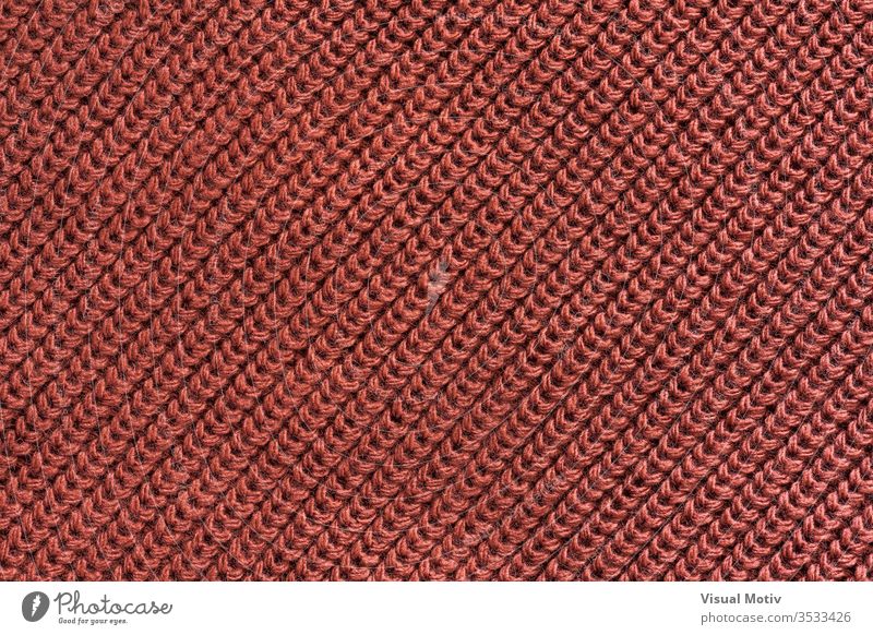 Textur eines Gestricks aus roter Wolle Textil texturiert Mode Gewebe Hintergrund Oberfläche Design abstrakt Nahaufnahme niemand Detailaufnahme Strickwaren