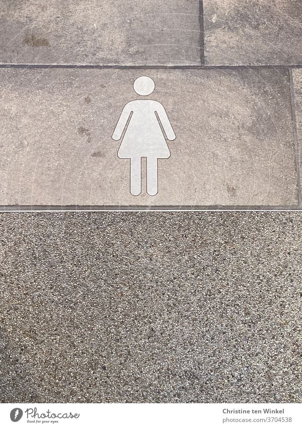 Piktogramm Frau / Mädchen auf grauen Fliesen Schilder & Markierungen Hinweisschild Zeichen Farbfoto Fliesen u. Kacheln Innenaufnahme Toilette Fußboden
