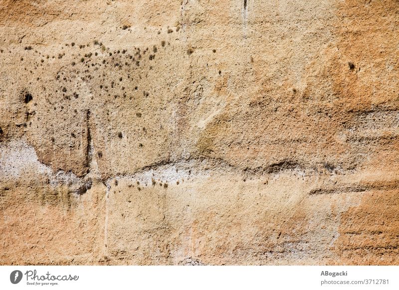 Kalksteinfelsen-Textur Hintergrund Felsen Oberfläche rau kalkhaltig uneben Tapete robust Stein braun Licht orange