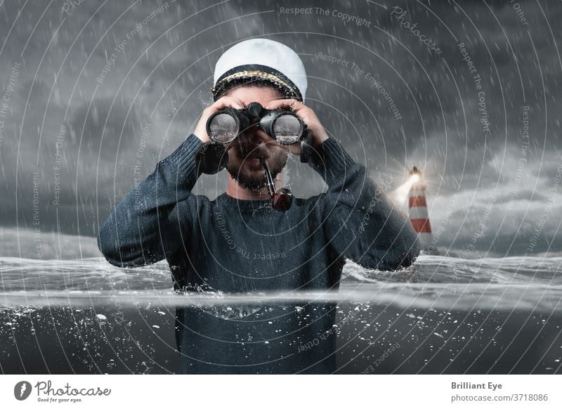 schiffbrüchiger Steuermann, der unter Wasser steht und mit dem Fernglas den Felsen im Wasser beobachtet Abenteuer allein grau Boot Kapitän Küste einheitlich