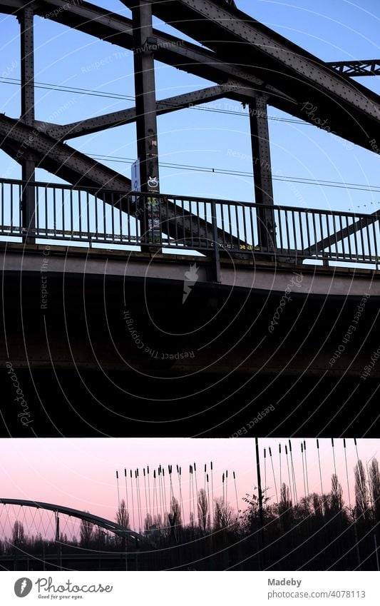 Deutschherrnbrücke und Osthafenbrücke im Licht der untergehenden Sonne am Hafenpark an der Europäischen Zentralbank EZB im Ostend von Frankfurt am Main in Hessen