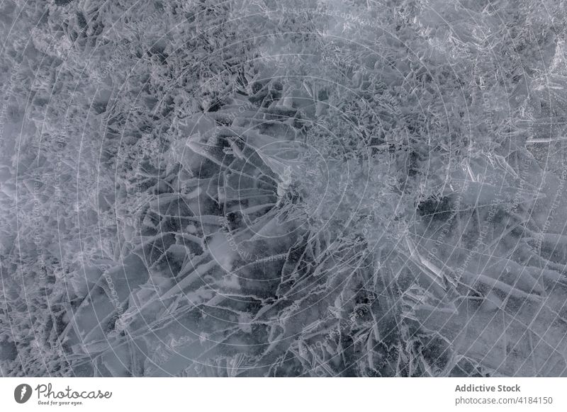 Abstraktes Muster eines zugefrorenen Sees im Winter Eis Textur Riss abstrakt Hintergrund Wasser chaotisch Oberfläche natürlich Frost Einfluss Baikalsee Sibirien