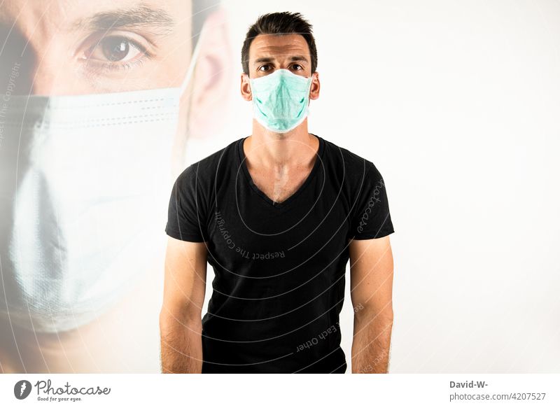 Mann mit Mundschutz / Atemschutzmaske Maske Corona Pandemie coronavirus schützen Maskenpflicht