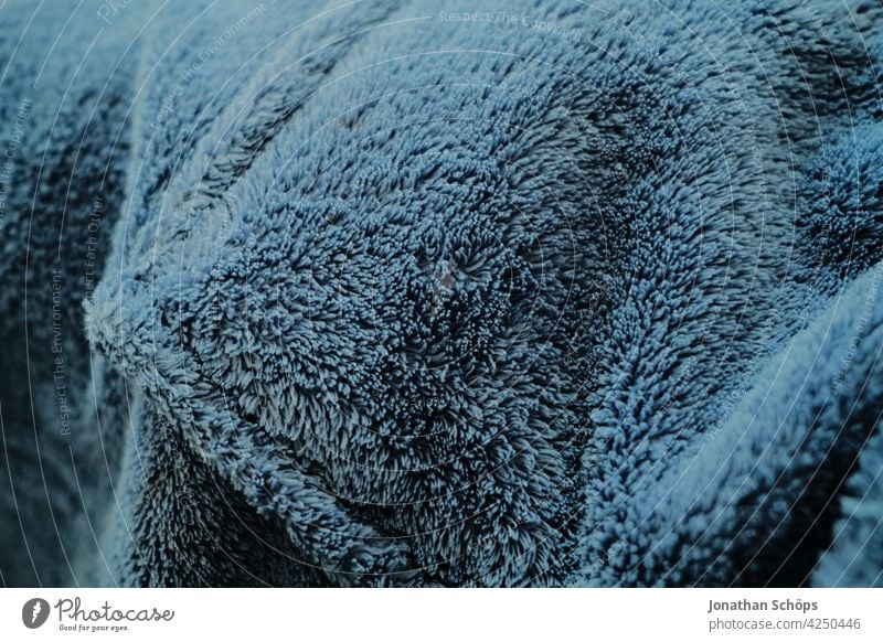 Textur blauer Bademantel Nahaufnahme Stoff Muster wärmend trocknen Hintergrund Textil Material Design Baumwolle Stil Gewebe Farbe Mode Oberfläche abstrakt