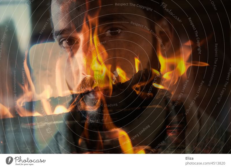 Doppelbelichtung: Männergesicht im Feuer Mann Gesicht Doppelbeichtung brennen Brand Flamme bärtig männlich verbrennen Wärme Blick Blick in die Kamera