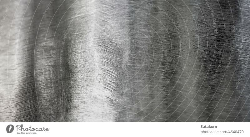 Glänzende Oberfläche und Kratzer auf Edelstahl Metall zerkratzen Hintergrund Textur rostfrei Stahl glänzend Kurve Industrie industriell abstrakt abschließen
