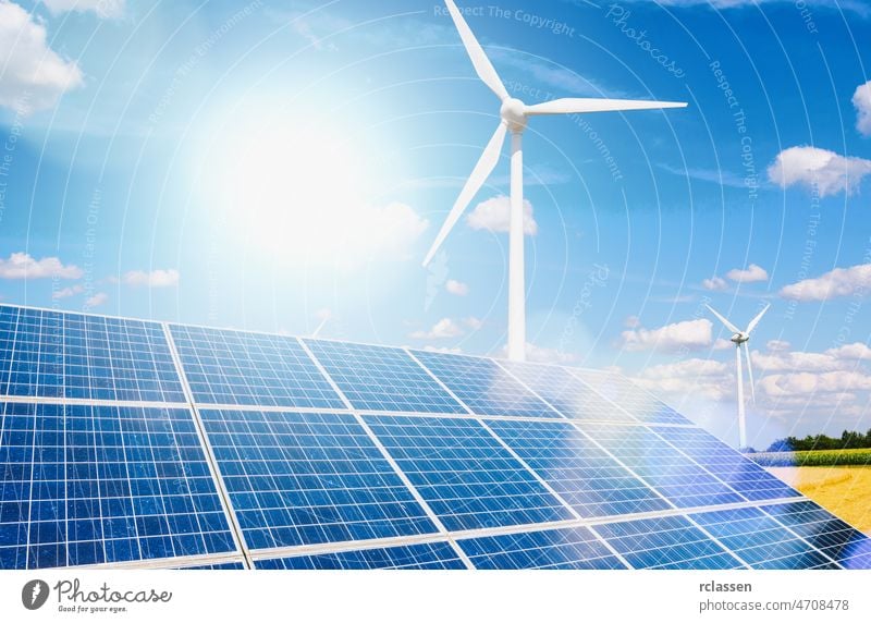 Sonnenkollektoren und Windturbinen zur Stromerzeugung: Solarenergie und Windenergie in Hybrid-Kraftwerkssystemen nutzen erneuerbare Energien zur Stromerzeugung mit blauem Himmel