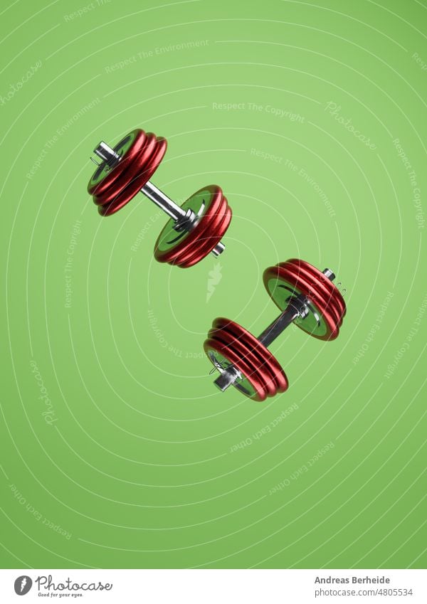 Zwei rote Metallhanteln auf grünem Hintergrund Kurzhantel Kalorien Gewicht Freizeit Fett disziplinieren passen stark Masse 3D-Rendering Sport Wohlbefinden
