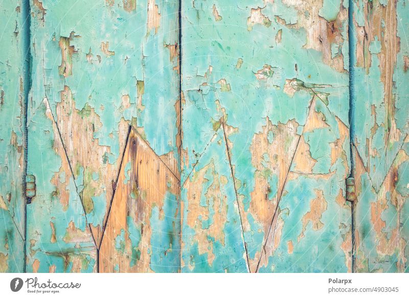 Holzfassade mit abblätternder Farbe abgenutzt farbenfroh Parkett Gate Tür türkis grün blau Linie Grunge angeblättert Antiquität Baum Fassade vertikal blanko
