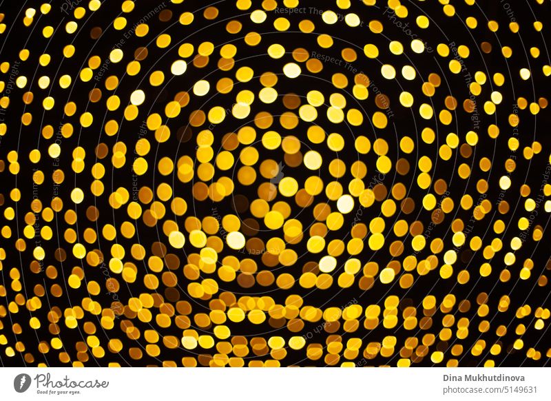 gelbe Bokeh helle Lichter Muster Hintergrund in der Nacht, runde Form goldenen Lichtern als Weihnachtsferien festliche Kulisse Glanz Weihnachten Neujahr