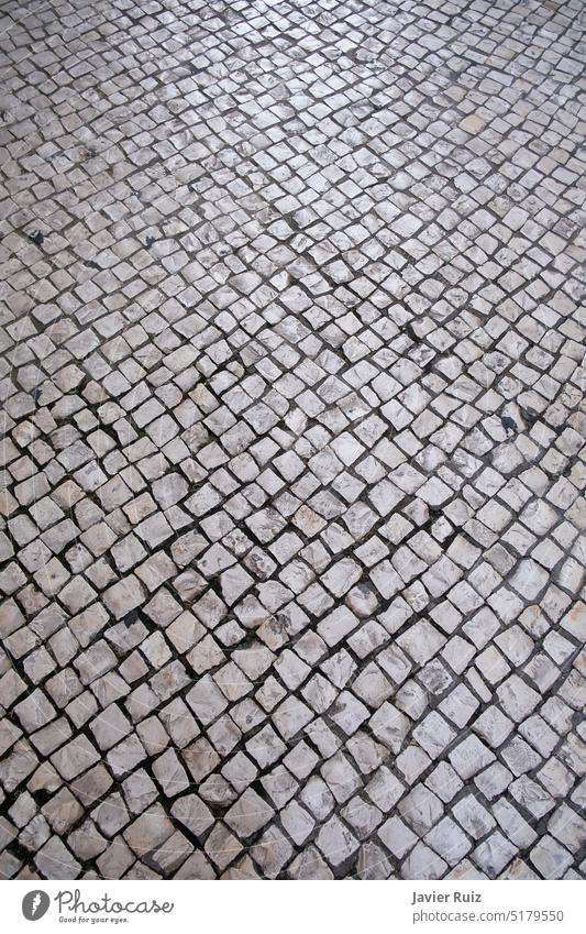 Portugiesische Fahrbahn oder portugiesisches Kopfsteinpflaster, mosaikartige Pflasterung Straßenbelag gepflastert Mosaik Textur Hintergrund Stock Stein Ziegel