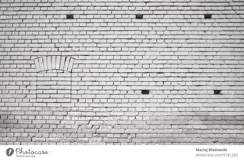 Alte Backsteinmauer Gebäude, Hintergrund oder Textur. alt Baustein Wand Muster Architektur Fassade grau Klotz Tapete Zement im Freien verwittert