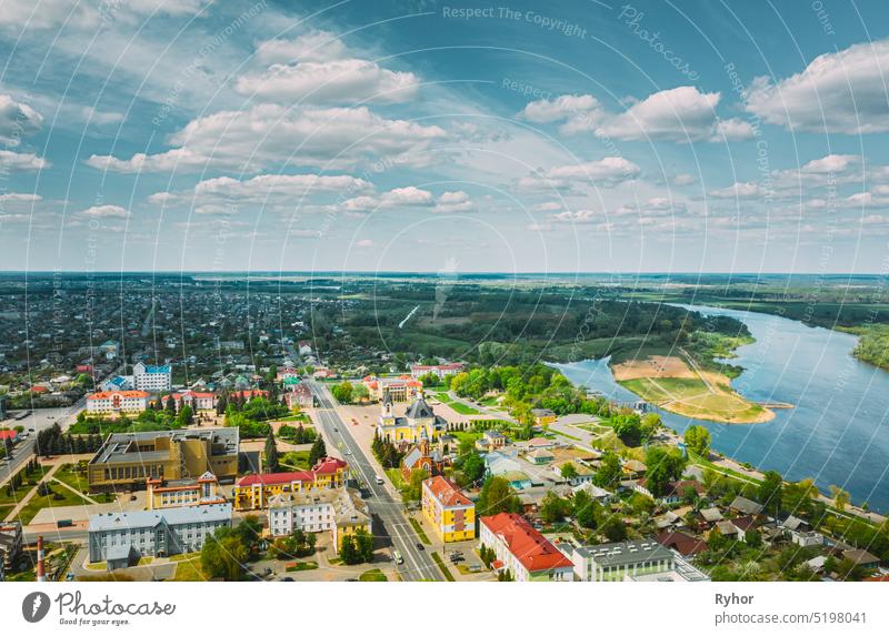 Rechytsa, Weißrussland. Aerial View of Residential Houses and Famous Landmarks Of Town: Holy Assumption Cathedral and Holy Trinity Church In Sunny Summer Day.
