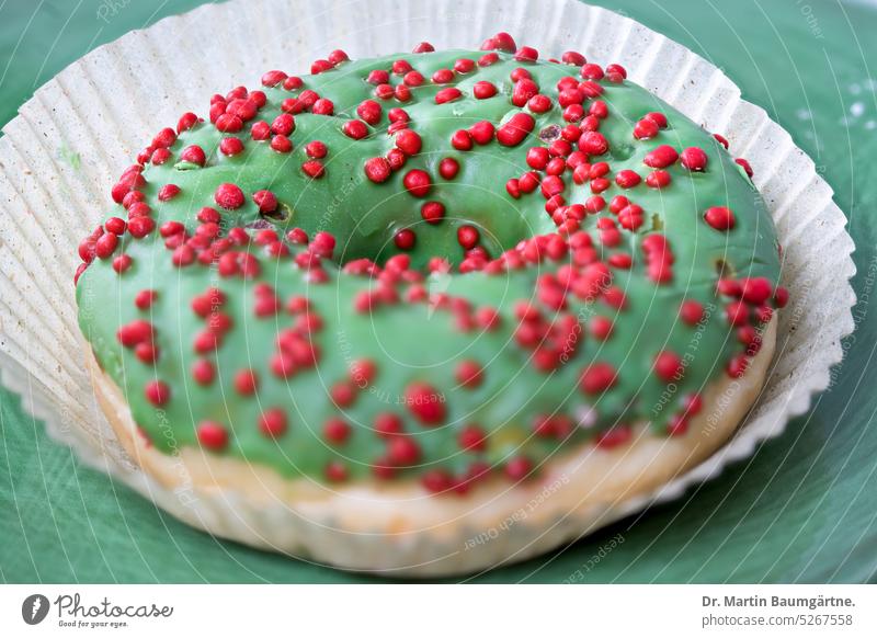 Ein Donut, miau Gebäck Hefegebäck Zuckerglasur grün süß Süßspeise Lebensmittel