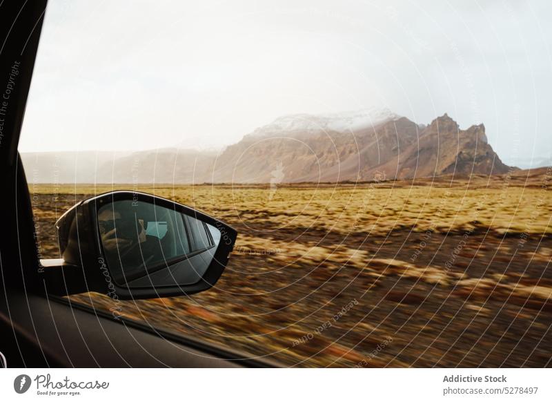 Seitenspiegel während der Fahrt PKW Spiegel Reflexion & Spiegelung Autoreise Sonnenschein Berge u. Gebirge Landschaft Laufwerk reisen Sonnenaufgang Island