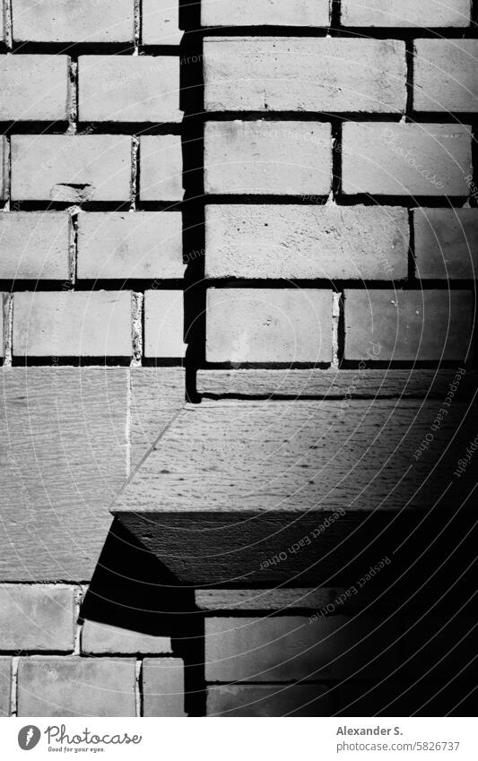 Mauerdetail im Sonnenlicht Detailaufnahme Stein Steine Mauerwerk Wand Sandstein Strukturen & Formen Architektur Backsteinfassade Muster Gebäude Backsteinwand