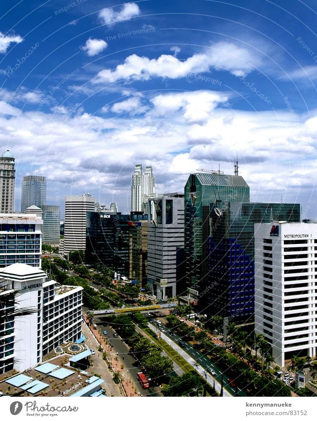 Jakarta's Scrapers Stadt capital city Indonesia buildings main road clouds noon office buildings